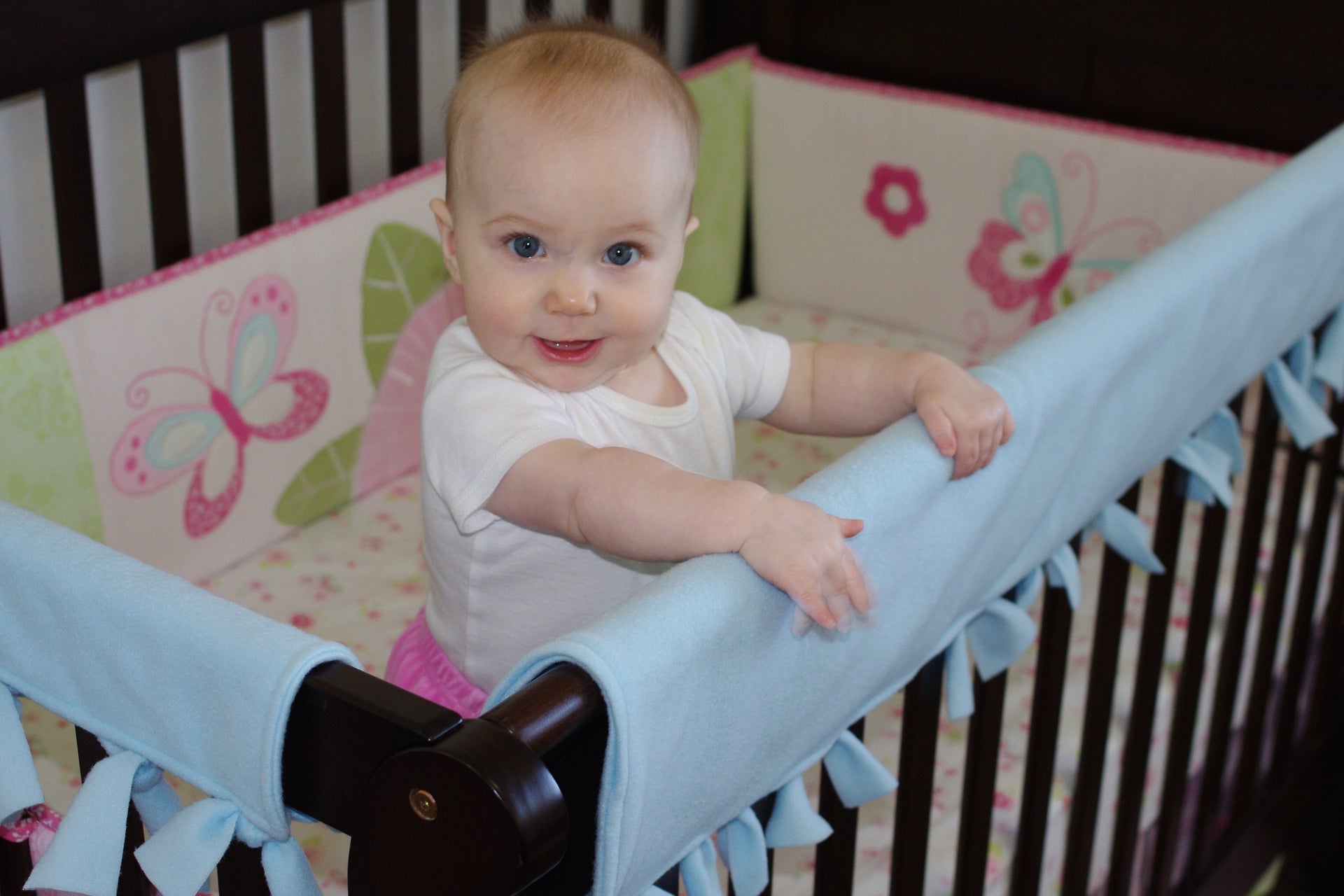 How to Install a Bumper Pad on a Crib 